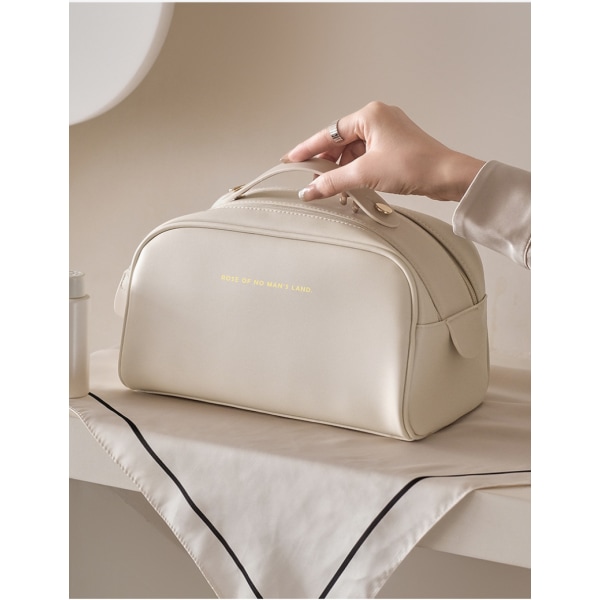 Mini-kosmetikväska i massivt läder white brown