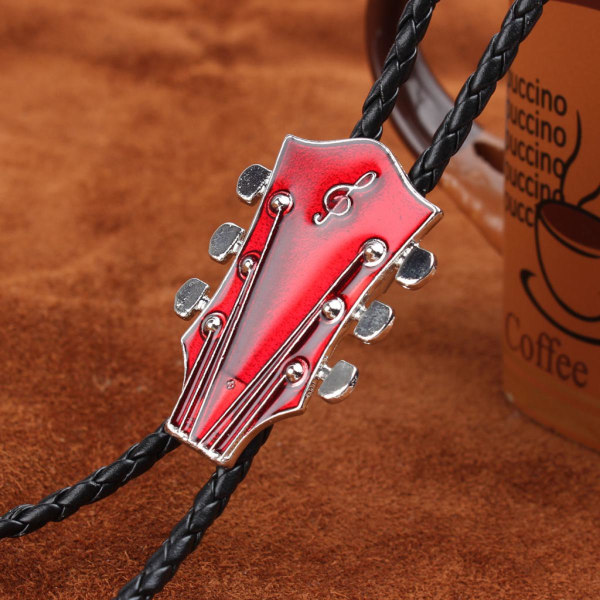 Vintage lantlig nostalgisk cowboy gitarr bolo läder röd slips