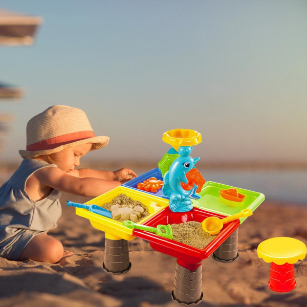 Strandsandleksaksbord vatten sand