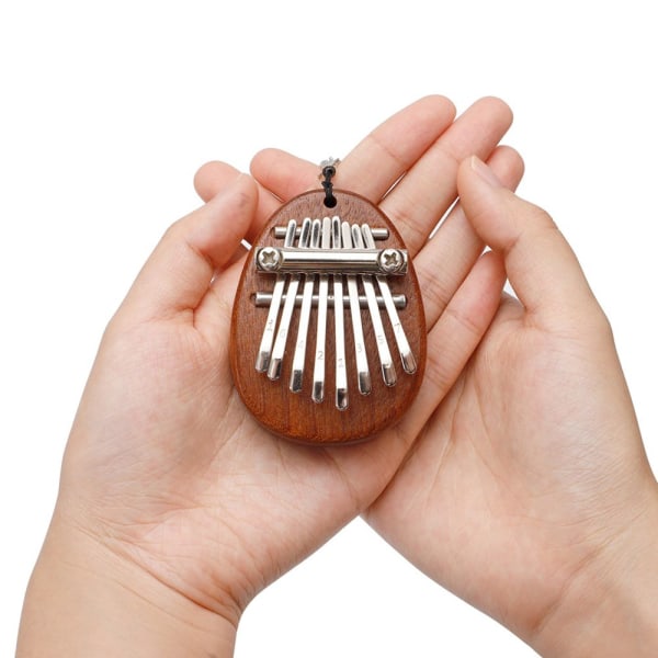 1 st 8-tangenters Kalimba Tum-Piano Hänge Kan Spela Fantastiskt Ljud För Vänner Oval