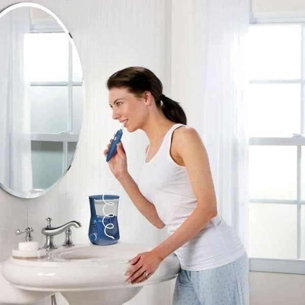 Waterpik Ultra Plus WP-663 blå hydropuls för fast montering, 10 trycknivåer, 1250 pulser/min, 1-min timer, 7 munstycken blå one size