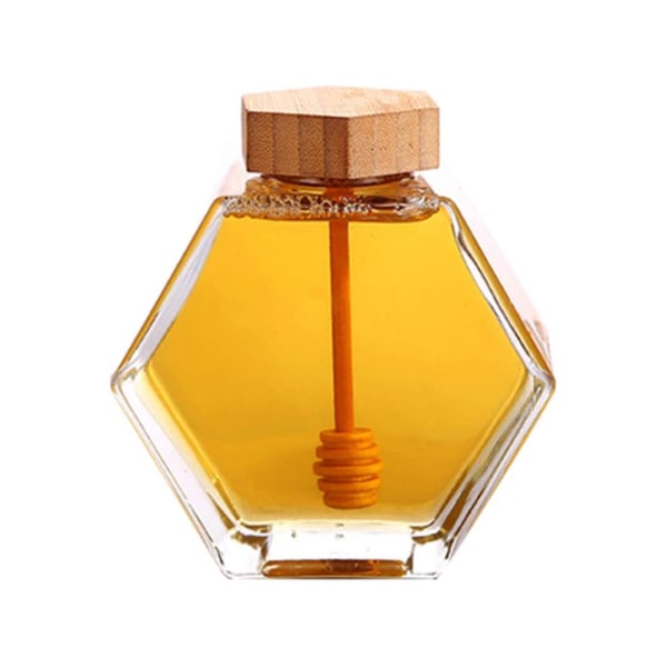 Kuusikulmainen hunajapurkki, jossa on lämmönkestävä lasi