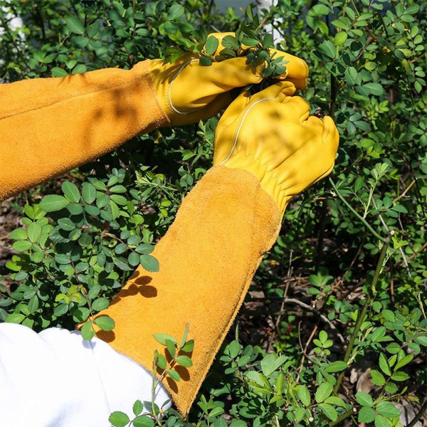 Trädgårdshandskar i läder med underarmsskydd, stick