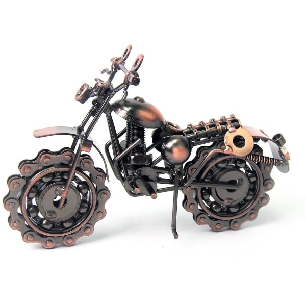 Vintage handgjord motorcykelmodell i järn med kedjehjul som