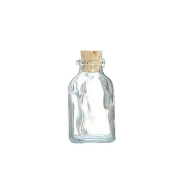 4 pientä lasipulloa 6 cm korkilla Transparent