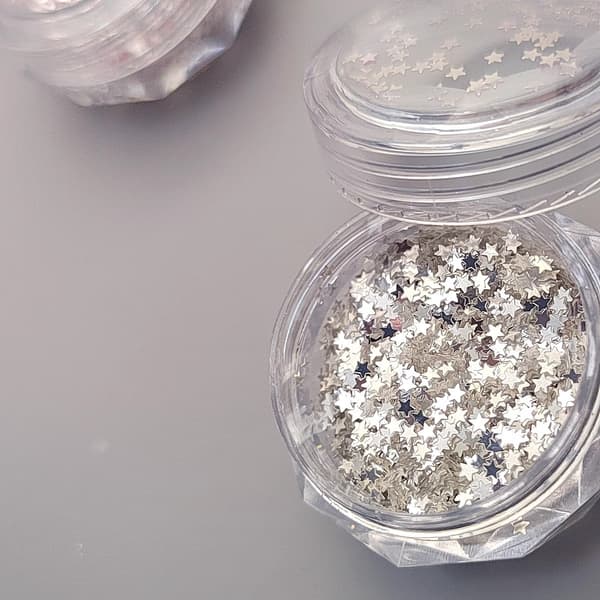 Kosmetisk glitterstjerner til brug i ansigtet - Sølv