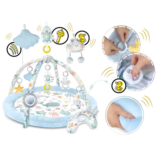 Interaktiv Babymatta Ocean⭐⭐⭐⭐⭐ för design och komfortHUVUDFUNKTIONER:- 7 multifunktionella leksaker- Dedikerad kudde för magläge- Sna