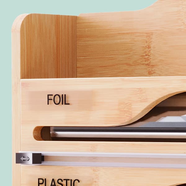 Seinälle kiinnitettävä talouspaperiteline folioleikkurilla