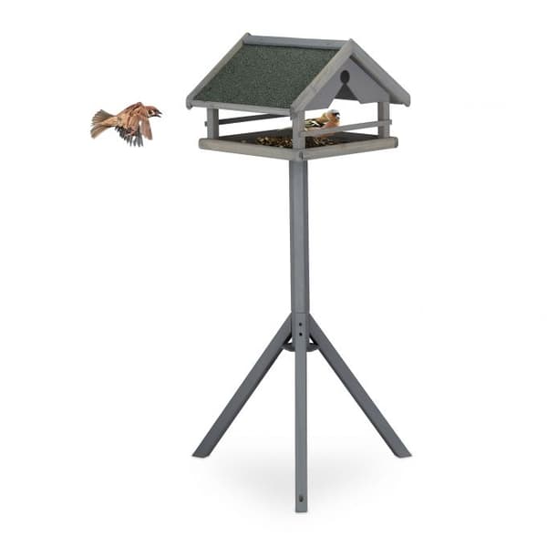 Grå fågelbord på stolpen