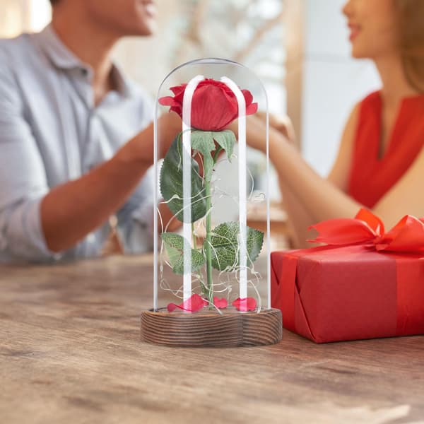 Evig rose i glas med stearinlys