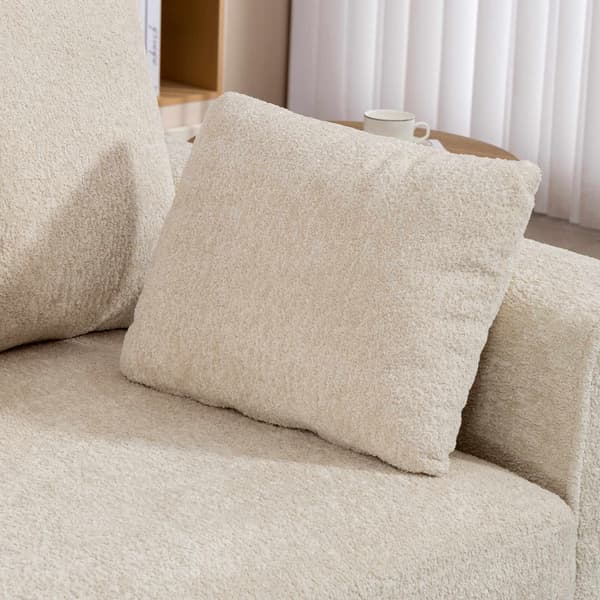 Beige 3-sitssoffa med sammetstyg och djup sits
