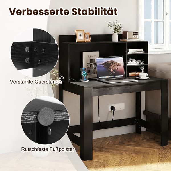 Sort computerbord med skuffe, stikkontakter og kabelhåndtering