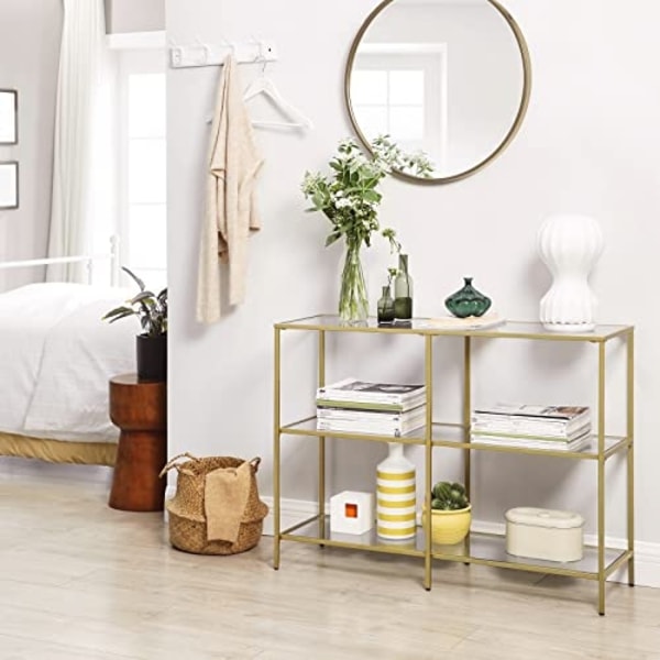 Elegant guld konsolbord med 3 hylder og glaspaneler