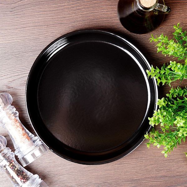 Pyöreä teräksinen grillilevy tarttumattomalla grillillä ja uunissa