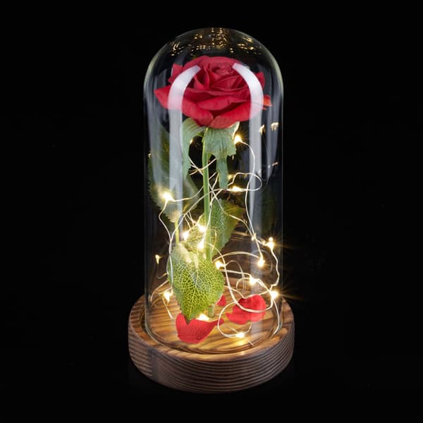 Evig rose i glas med stearinlys