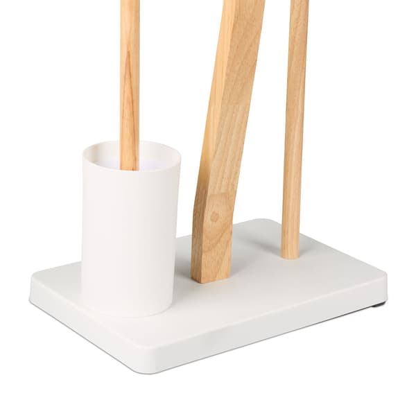 WC-paperiteline ja harjasetti hyllyllä