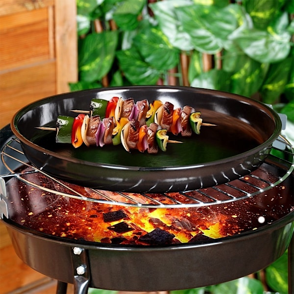 Pyöreä teräksinen grillilevy tarttumattomalla grillillä ja uunissa