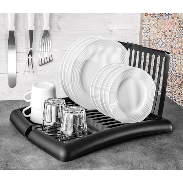 Utdragbart svart diskställ med plats för tallrikar och glas