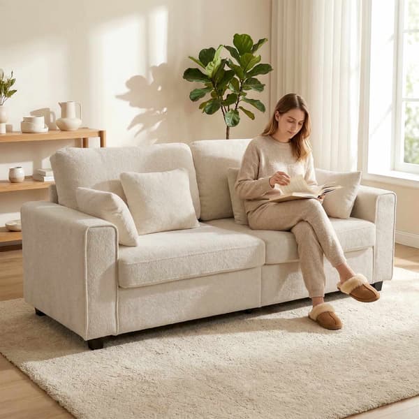 Beige 3-sitssoffa med sammetstyg och djup sits