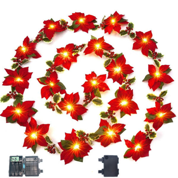 Julepynt med juleblomster og lyskæder