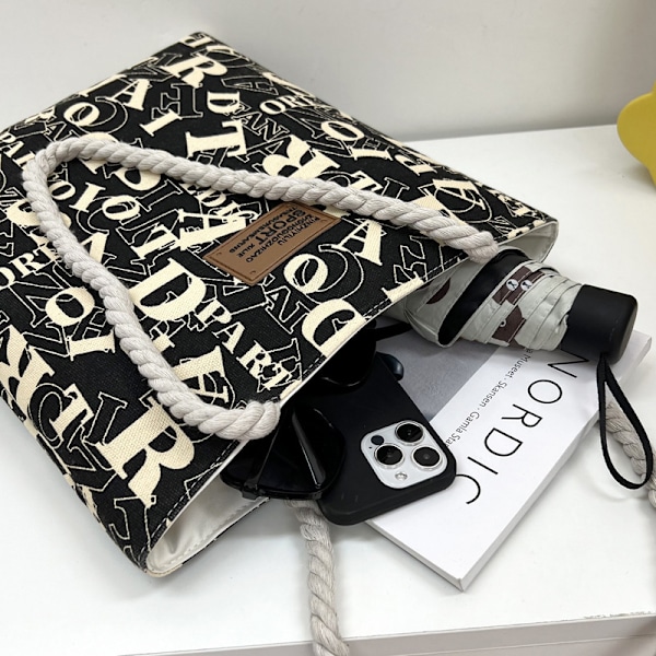 Sort Canvas Shoppingtaske - Stilren & Rummelig Tote
