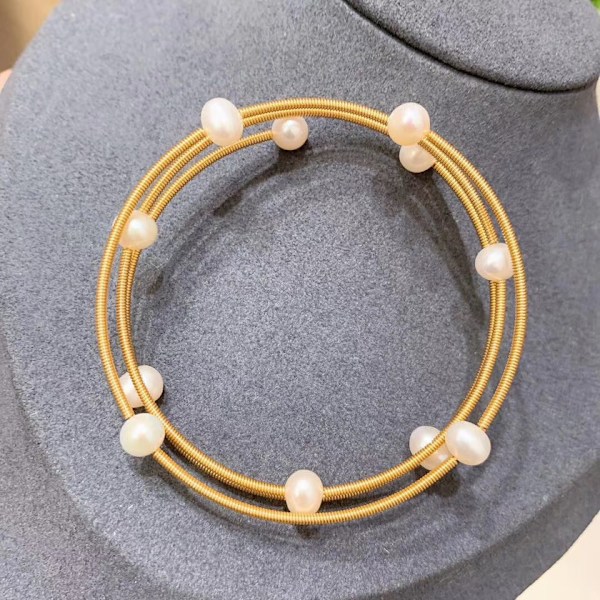 Hukommelsesstålspiral, 0,6 mm tråddiameter, 100 sløjfer/pakke, 44 g Guld Guld