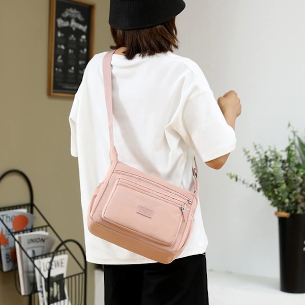 Trendikäs laukku naisille, crossbody-laukku, olkalaukku, tyttöjen laukku, käsilaukku, olkalaukku, useita osastoja, tilava sivulaukku matkustamiseen, pinkki