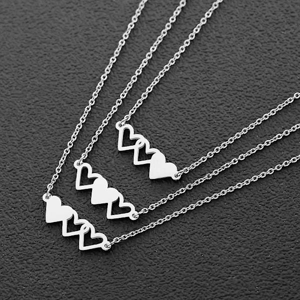 3 kpl titaaniteräskaulakorua, Three Sisters of Hearts -kaulakoru Silver