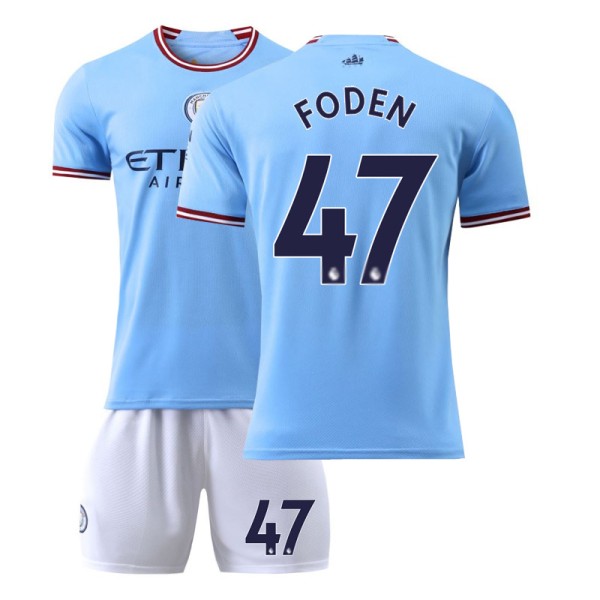 22-23 Manchester City hjemmefodboldsæt nr. 17 De Bruyne nr. 9 Haaland 47 Foden 7 Sterling trøje No. 47 w/ Socks + Protective Gear #22