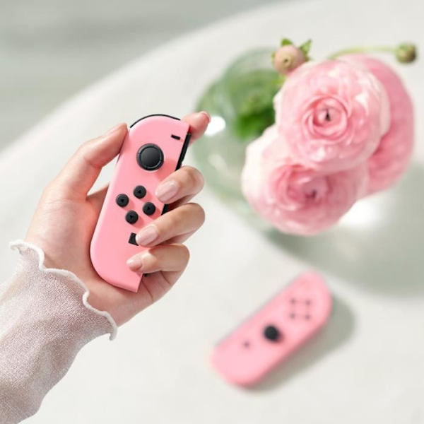 Ett par Pastell Pink Joy-Con-kontroller för Nintendo Switch Pastellrosa