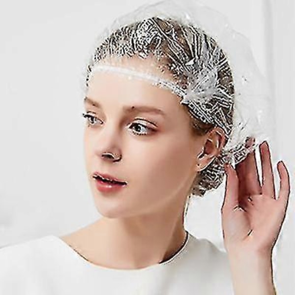 Pakke med 100 engangs, transparente dusjhetter for salong, spa og dusj