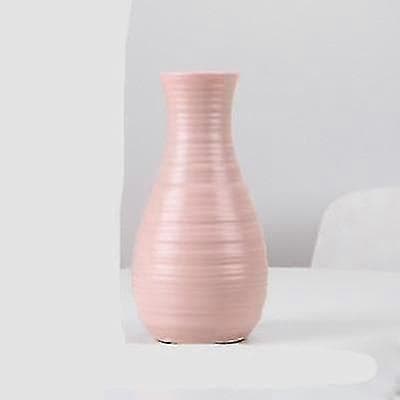 1 En vacker blomvas i plast, imitation av keramisk blomhållare