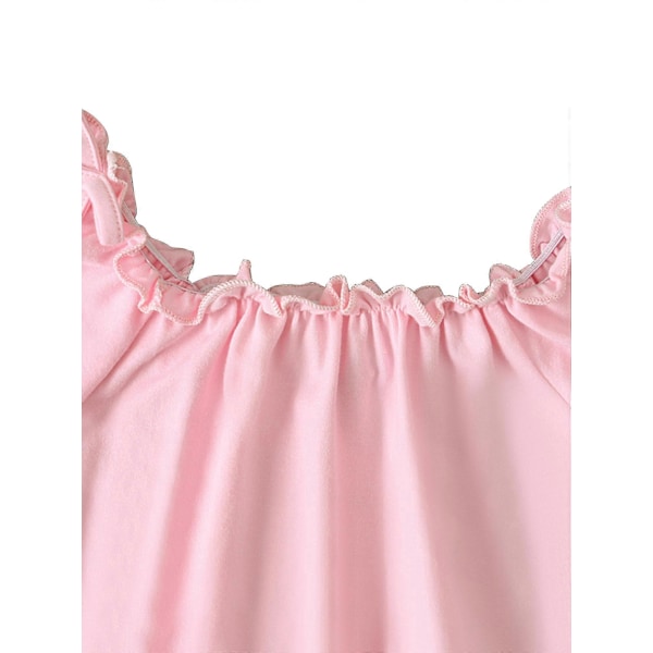 Flickset med rosettdekoration, enfärgad topp och blommiga shorts med resår i midjan