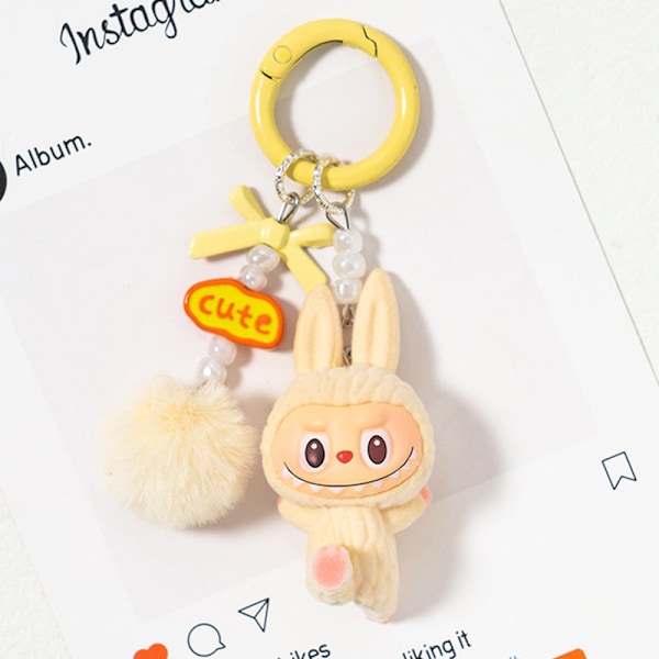 Söpö Mini Labubu Avaimenperä Sarjakuva Luova Kolmiulotteinen Nukke Opiskelijan Koululaukun Riipus Auton Avaimenperä Miehille ja Naisille Lahja ——MA yellow
