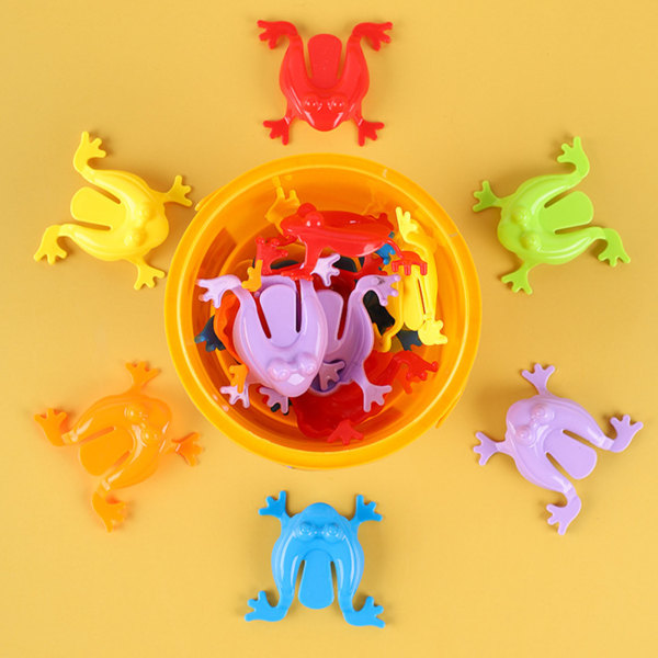 12 stk fargerike froskehoppende leker Finger Pressing Leaping Frogs med bøtte Kids Bouncing Toy Set Gaveeske Emballasje