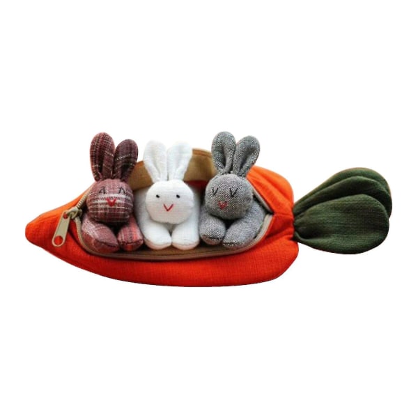 Kanindockans leksakskaniner i morotsväskan