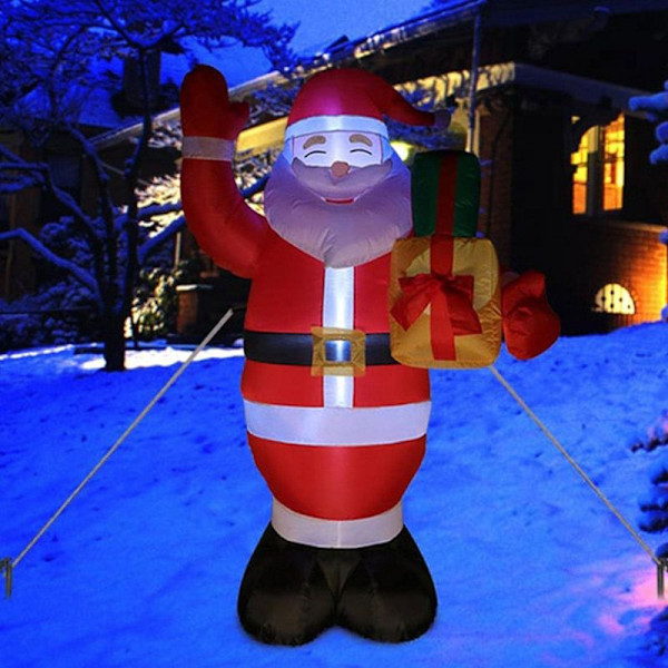Uppblåsbara juldekorationer välkomnar jultomten med lampor, uppblåsbara