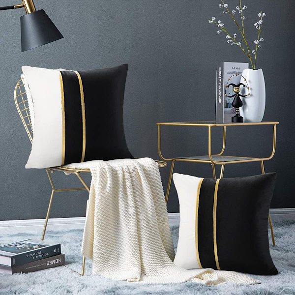 2 kappaleen tyynynpäällinen sohva musta tilkkutäkkikuvio neliö