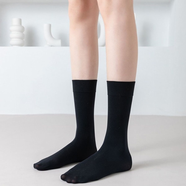 Gjennomsiktige knær i silke. Mid-top sokker sorte 27 cm KLB