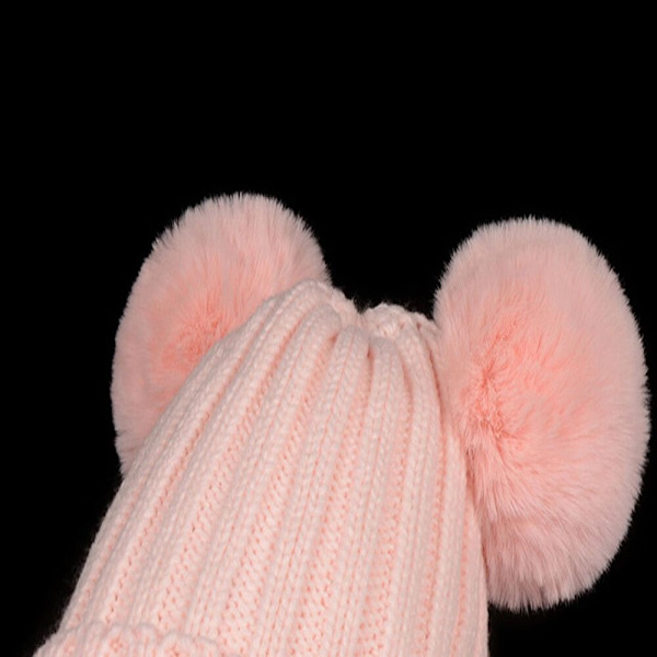 En rosa dobbel ullhatt i størrelse S (barn 30-50 cm)