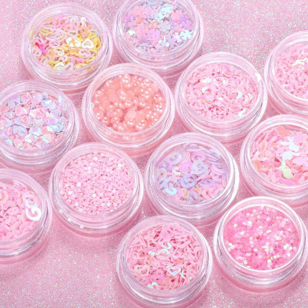 12 laatikkoa kynsien koristeluun tarkoitettuja glitter-paljetteja, jotka tekevät kynsistäsi kiiltävät ja värikkäät