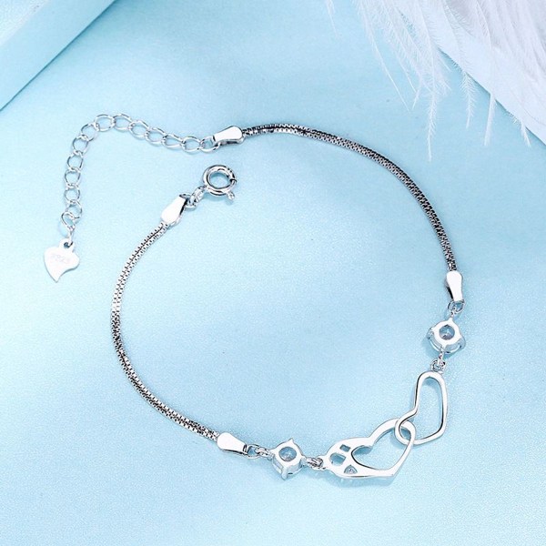 Hjärta av två zirkoner, justerbart armband i sterlingsilver