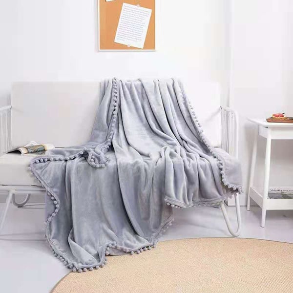 Flanellteppe, pomponger, koselig teppe, sofateppe - fleeceteppe for sofa, hvit