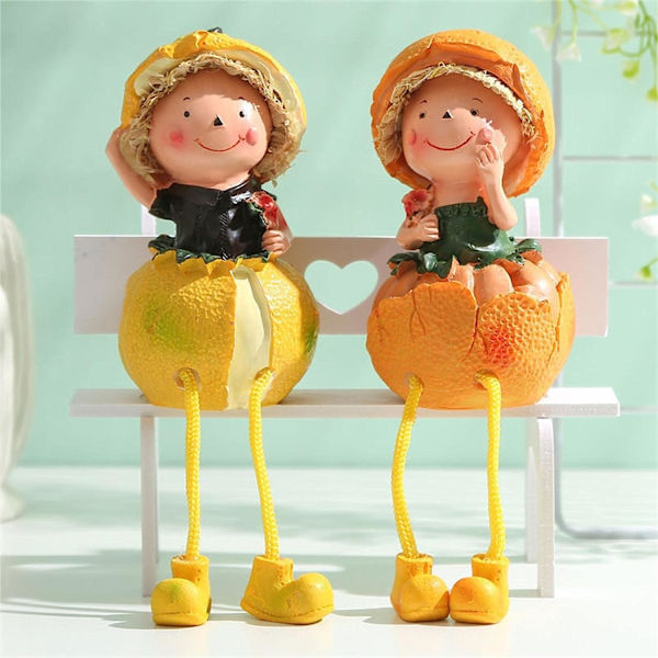 Söta orange flicka docka statyer kawaii långa ben resin figurin dekor