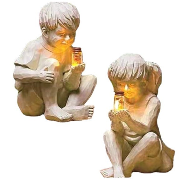 Trädgårds dekorativ staty ett barn med soldriven eldfluga