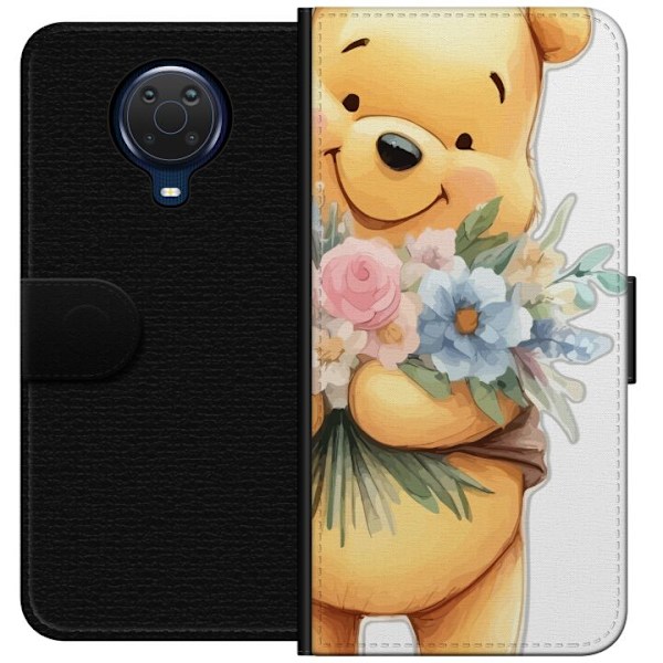 Nokia G20 Tegnebogsetui Nalle Puh med blomster - klassisk børnefavorit i en blomstrende forårs miljø