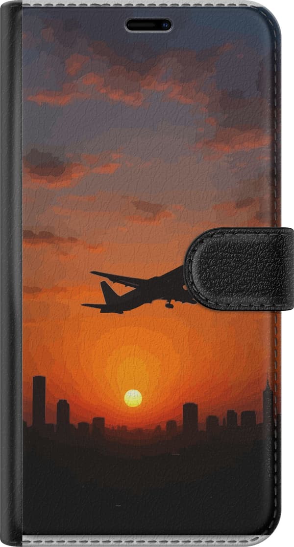 Kompatibel Tegnebogsetui til Google Pixel 7a Sort flysilhuet over en by i orange solnedgang orange