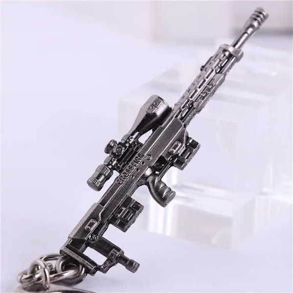 Højkvalitets ny stil Nyhed Counter Strike Pistol Ak47 Nøglering Mænd Ornament Awp Riffel Sniper Cs Go Saber Herretasker Bil Nøglering Smykker Souvenirs 25