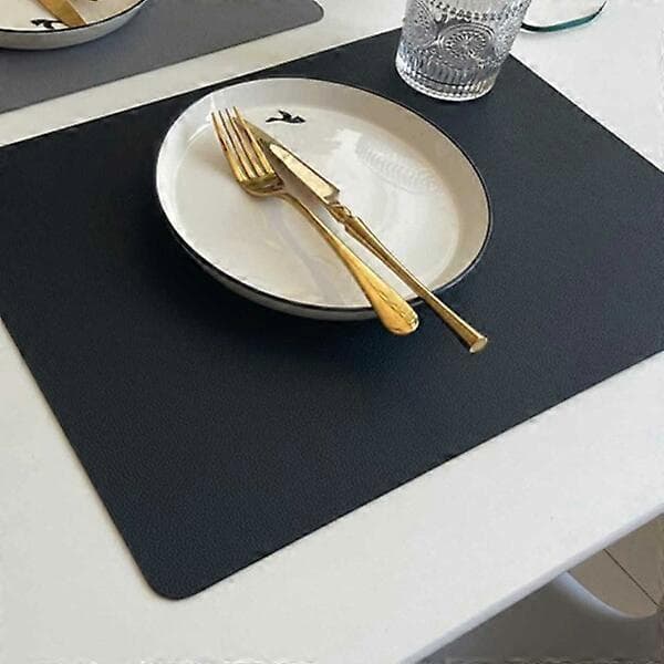 4-pak dækkeservietter i kunstlæder rektangulær sort 43x30cm sort