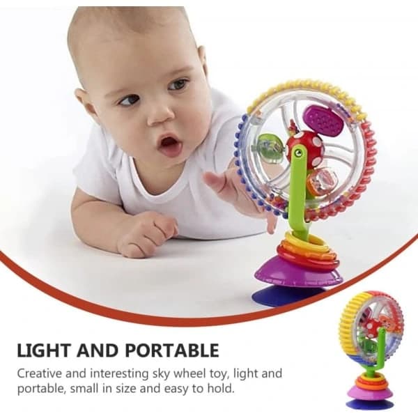 Baby rattle with suction cup and rotating wheel for strollers
